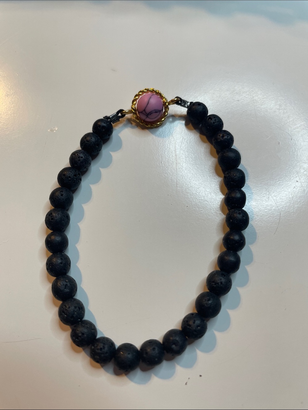 Stretchy Black Lava Bead Bracelet with Pink Accent Cabochon